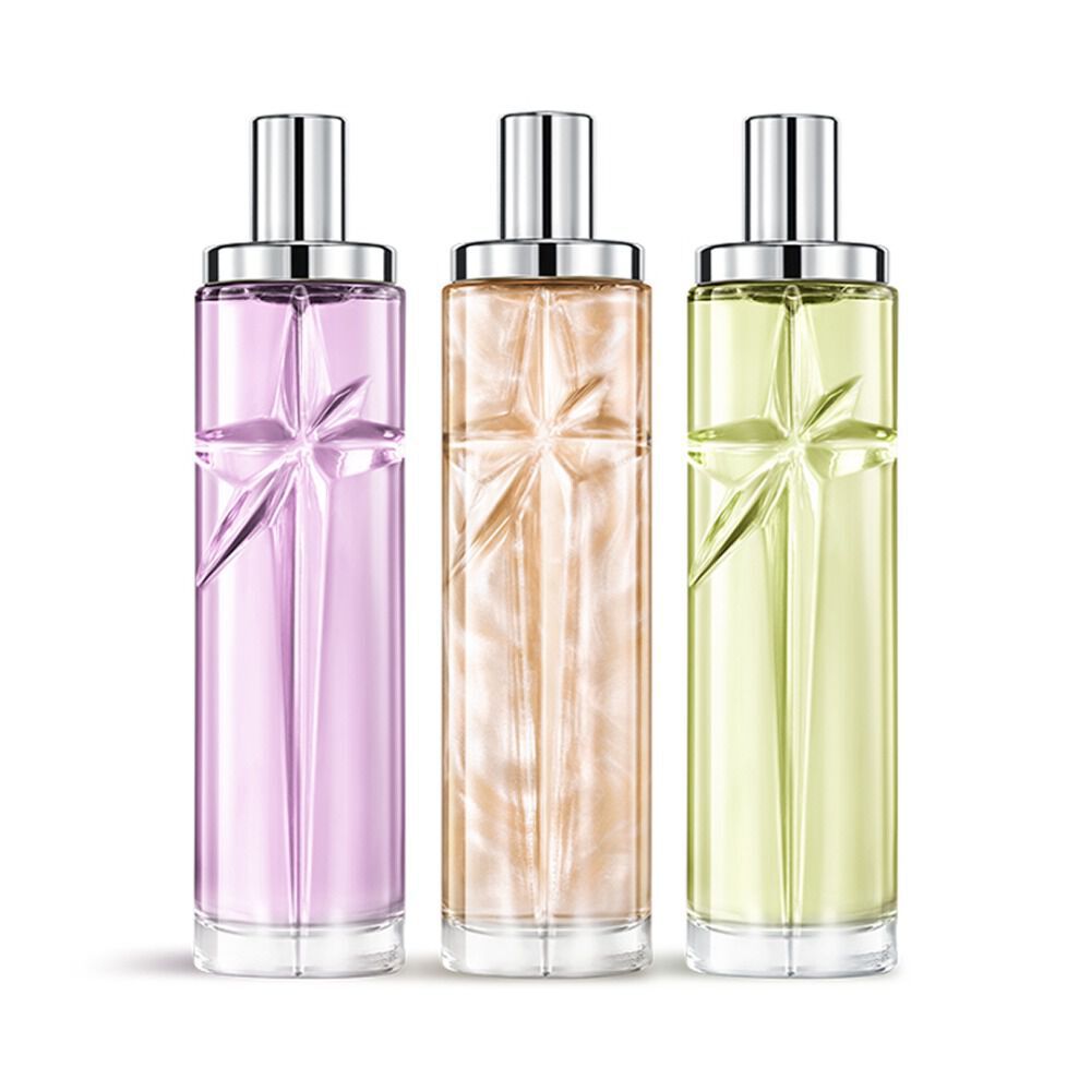 Starlicious the yummy swirl paquet superpose avec Berry Licorice, Pineapple Musket Pistachio Praline, des bouteilles en verre avec une etoile filante sculptee, ses facettes brillant sous un capuchon argente elegant.