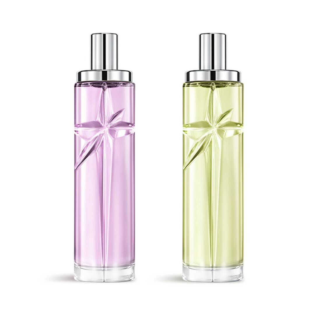 Starlicious the gourmet berry paquet superpose avec Pistachio Praline et Berry Licorice, des bouteilles en verre avec une etoile filante sculptee, ses facettes brillant sous un capuchon argente elegant.