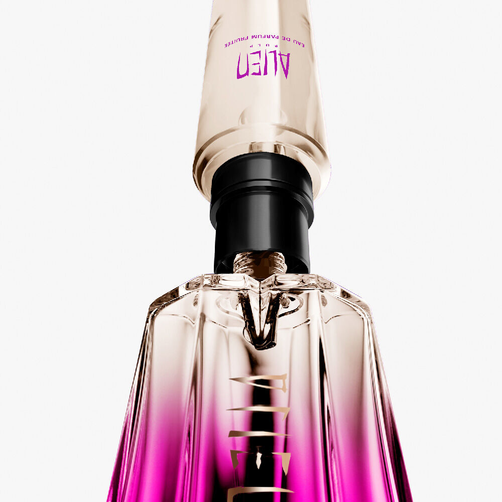 Close-up of the Mugler Alien Pulp bottle's refillable mechanism, showing the golden and black pump integrated into the elegant glass design.