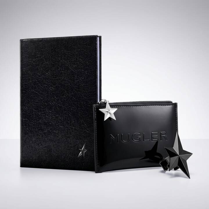 un bloc note noir, une trousse noir mugler et une etoile noir sur un fond gris clair