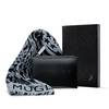 un bloc notes noir, une pochette noire mugler et un pareo bleu etoile
