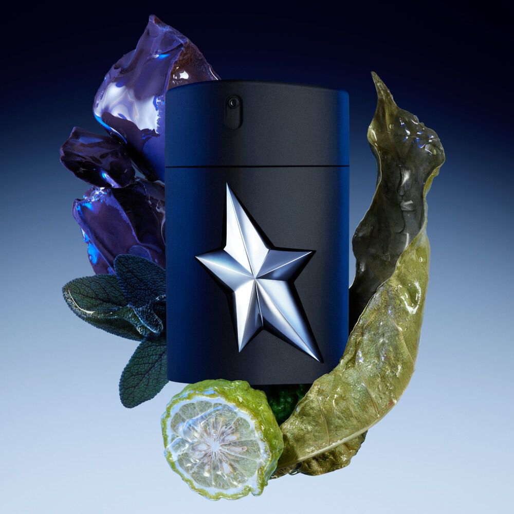 flacon de parfum amen mugler noir avec une etoile blanche