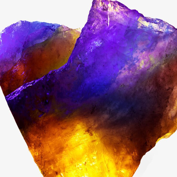 Alien par Mugler : cristal d'ambre blanc aux reflets violets et dorés lumineux