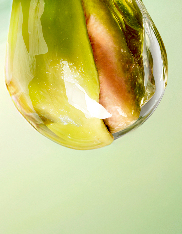 une pistache verte sur un fond vert clair.